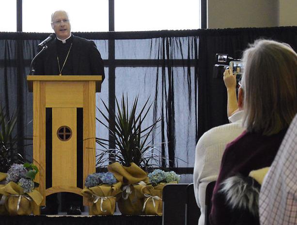 Bishop W. Shawn McKnight addresses the crowd of parents, staff and members of the community